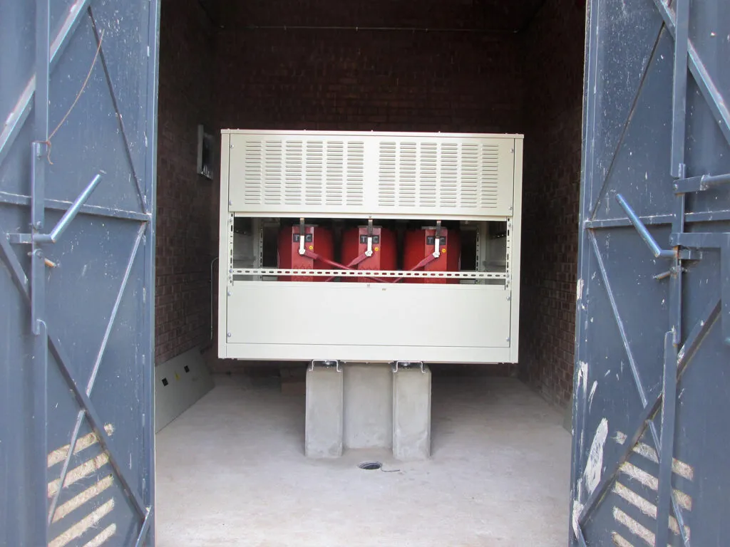 A 200 kVA cast resin transformer in an IP42 enclosure installed in transformer room for mining project.