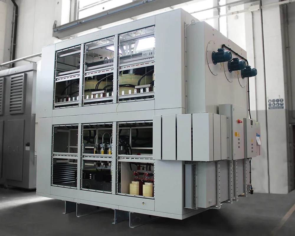 A specialised IP54-rated enclosure with an integrated heat exchanger contains a dry-type transformer, providing effective cooling and superior protection against dust and moisture.